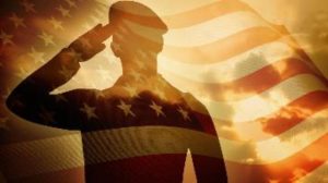 Silhouette of soldier saluting with US flag overlay